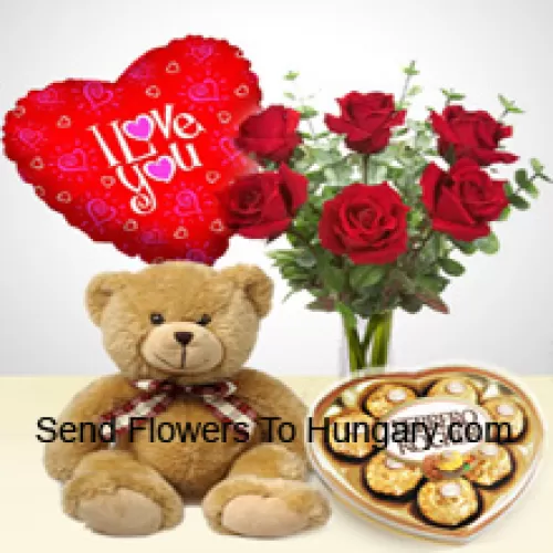 7 roses rouges avec des fougères dans un vase en verre, un mignon ours en peluche brun de 14 pouces de haut, 8 pièces de Ferrero Rocher en forme de cœur et un ballon "Je t'aime"